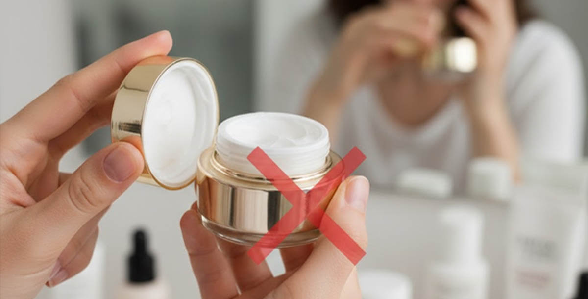 Woman applying expensive moisturizer